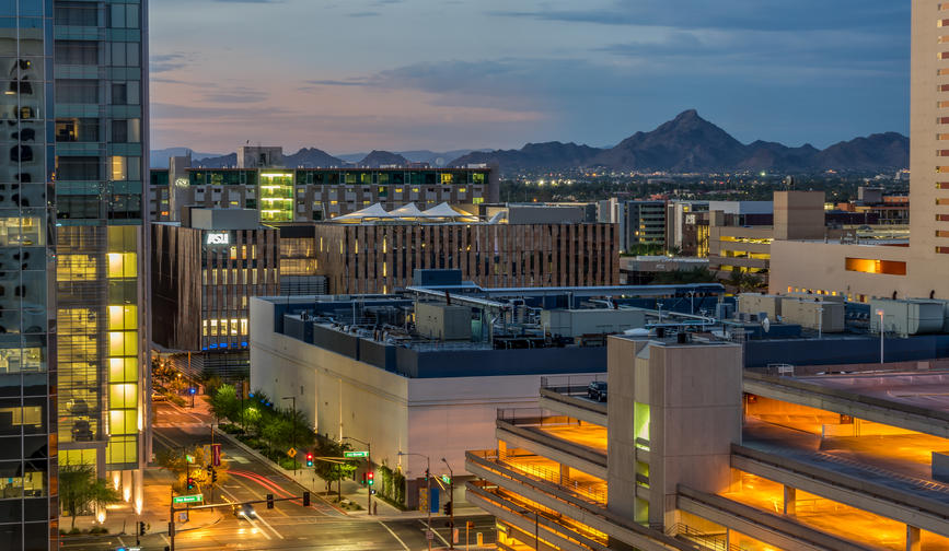 Phoenix, Arizona USA evening city view with mountain in the background
